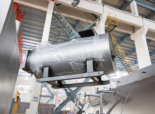 已完成局部油漆的永乐高锅炉从油漆房吊出